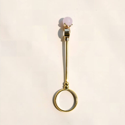 Six gold cigarette holder rings with shimmering colored balls showing dimensions of 7.8cm length and 2cm ring diameter