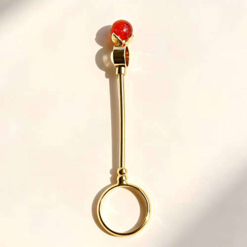 Six gold cigarette holder rings with shimmering colored balls showing dimensions of 7.8cm length and 2cm ring diameter