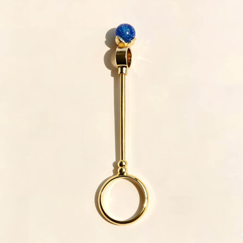 Six gold cigarette holder rings with shimmering colored balls showing dimensions of 7.8cm length and 2cm ring diameter