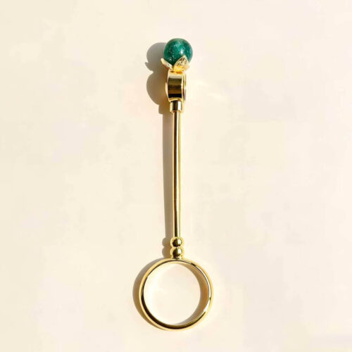 Six gold cigarette holder rings with shimmering colored balls showing dimensions of 7.8cm length and 2cm ring diameter